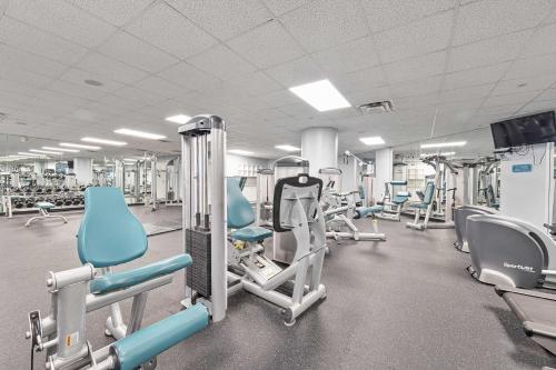 a gym with a lot of chairs and machines at Penthouse Beach Villa Ocean Walk Resort Daytona in Daytona Beach