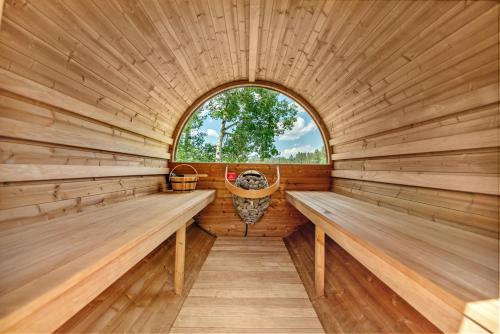 a sauna with two benches and a window at Hottub Hideaway BHBungalows #6 in Custer