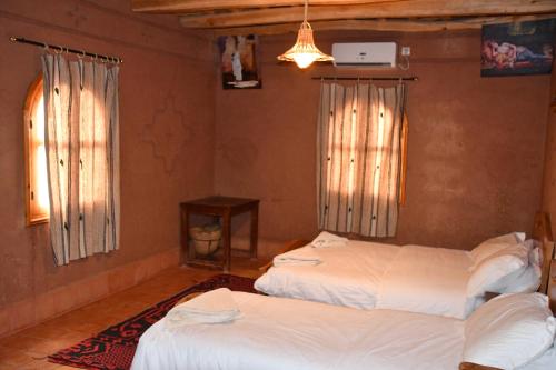 Cama o camas de una habitación en Gîte d'étape Tamaloute