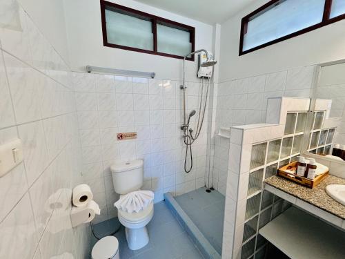a bathroom with a shower and a toilet at Lamai Bayview Boutique Resort in Lamai