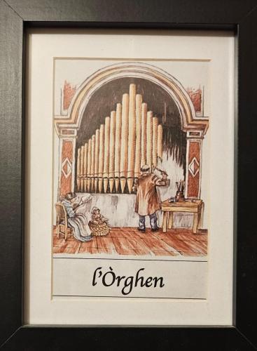 a picture of a framed picture of a organ at il Sole di Baggio in Milan