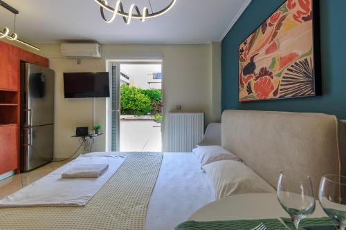 Postel nebo postele na pokoji v ubytování Aiolos GLYFADA super lux apartment