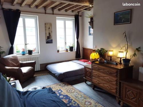 a bedroom with a bed and a desk and window at Centre ville plage à 1500m gare à 500m in Fécamp