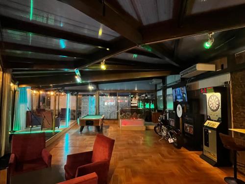a room with a ping pong table in a room at HMC K-ena in Andorra la Vella