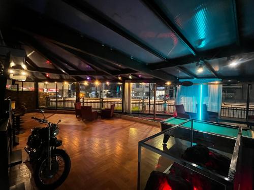 a room with a aquarium and a motorcycle in it at HMC K-ena in Andorra la Vella