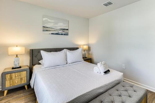 a small bedroom with a bed and a nightstand at Brand-New Savannah Area Home 15 Mi to Dtwn! in Port Wentworth