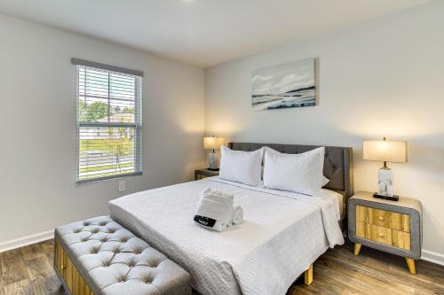 a bedroom with a large bed and a couch at Brand-New Savannah Area Home 15 Mi to Dtwn! in Port Wentworth