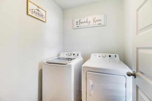 a white laundry room with a washer and dryer at Brand-New Savannah Area Home 15 Mi to Dtwn! in Port Wentworth