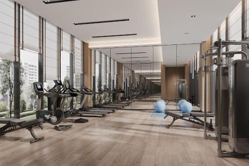 a gym with a row of treadms and machines at Fairfield by Marriott Changshu Hi-Tech Zone in Changshu