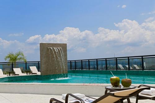 a swimming pool on the roof of a building at Intercity Manaus in Manaus