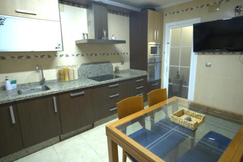 Η κουζίνα ή μικρή κουζίνα στο Giralda Loft Deluxe