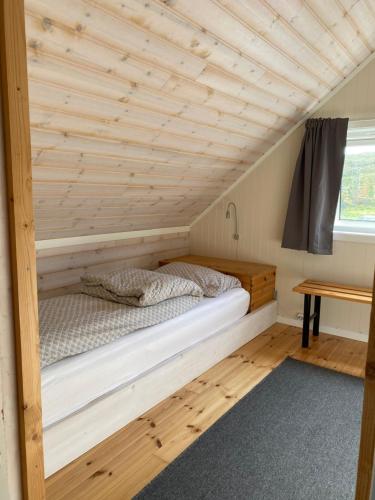 Postel nebo postele na pokoji v ubytování Vannøy Sport og Havfiske