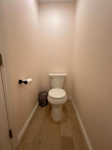 a bathroom with a white toilet in a room at Pristine Poway Retreat in Poway