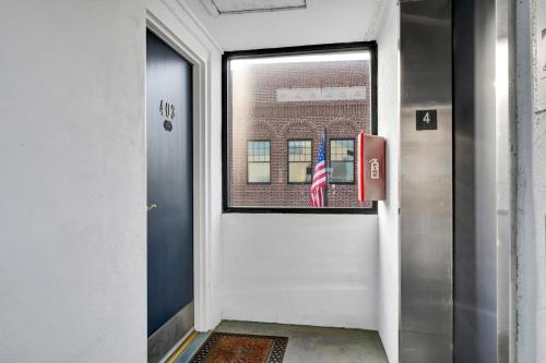 a door with an american flag sticking out of it at The Waterway 403 by Sea Scape Properties in Wrightsville Beach