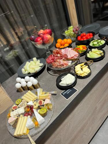 a buffet with many different types of food on a table at Bergwelt Kandel Hotel & Eventlocation in Waldkirch