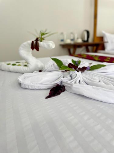 Postel nebo postele na pokoji v ubytování Kendwa Crystal Coast Hotel