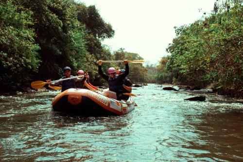 a group of people on a raft in a river at SR Brotas in Brotas
