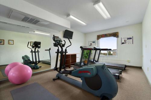 a gym with exercise bikes and a exercise ball at Super 8 by Wyndham Yellowknife in Yellowknife