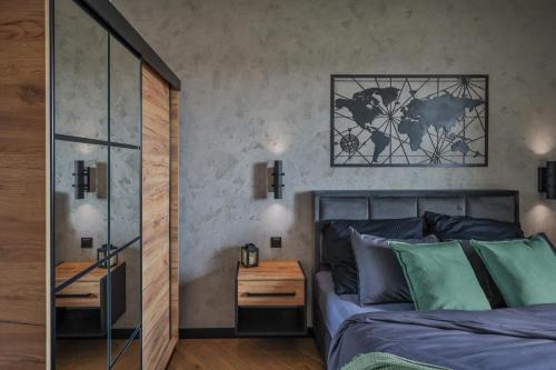Ένα ή περισσότερα κρεβάτια σε δωμάτιο στο Loft Apartments Uniejów