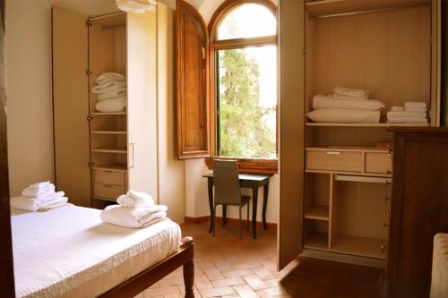 Ένα ή περισσότερα κρεβάτια σε δωμάτιο στο SassiNeri Country House