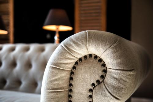a close up of a persons foot on a couch at SWISS MORAIRA HOTEL & SPA - Adults only in Moraira