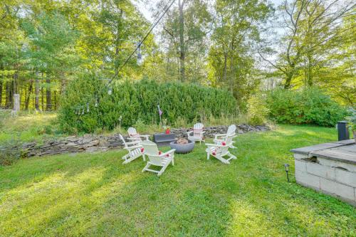 a group of chairs and a fire pit in a yard at Saugerties Farmhouse Sauna and Countryside Views in Saugerties
