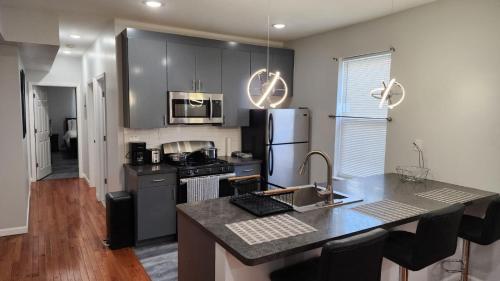 a kitchen with a counter top and a refrigerator at Comfortable Apartment in Irvington