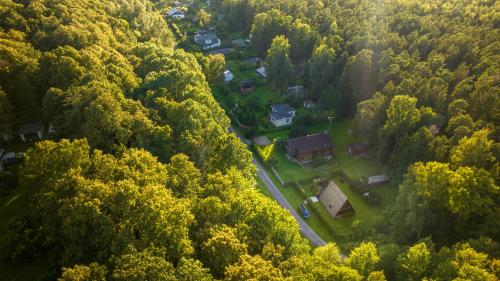 an aerial view of a house in the middle of a forest at Roo Resort in Suurupi