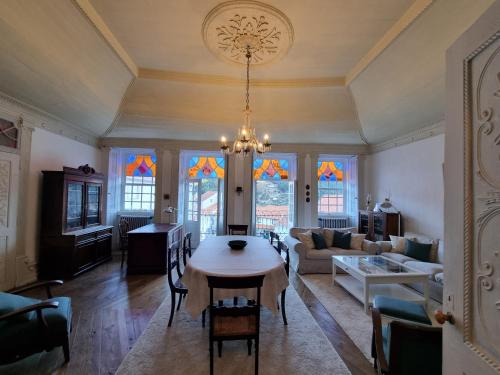a living room with a table and a couch at Manteigas Lovers in Manteigas