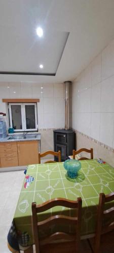 a kitchen with a table with a bowl on it at Casa VazPeralta in Castanheira de Pêra