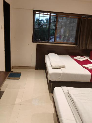 Katil atau katil-katil dalam bilik di Hotel Anand Palace