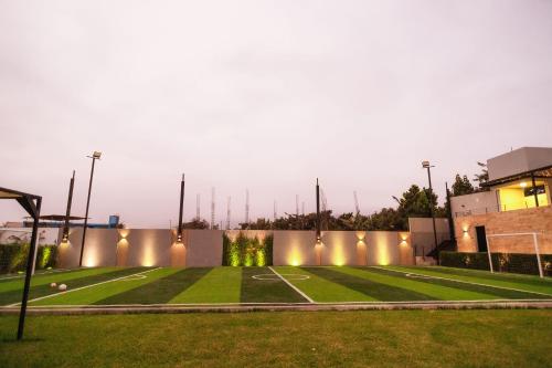 an empty soccer field at night with lights at Awqa Loft & Camp in Trujillo