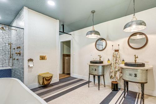 a bathroom with two sinks and a shower at Benton Harbor Home 3 Mi to Beach Grill and Yard in Benton Harbor