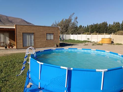 a swimming pool in the backyard of a house at Estancia Don Beto in Pan de Azúcar