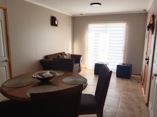 a living room with a dining room table and chairs at Estancia Don Beto in Pan de Azúcar