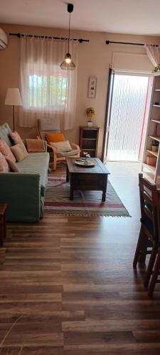 a living room with a couch and a coffee table at EL LLIMONER in Sant Jordi
