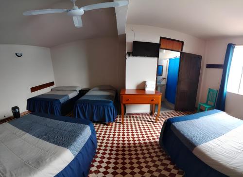 Postel nebo postele na pokoji v ubytování Hotel Cortaza Galería