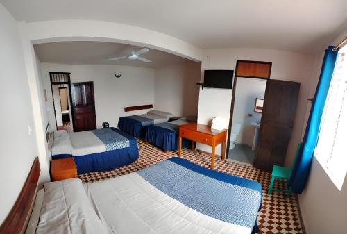 Postel nebo postele na pokoji v ubytování Hotel Cortaza Galería