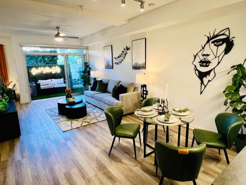 a living room with a couch and a table at Luxury Open BD w Pool, Parking, & WD 133 in Los Angeles