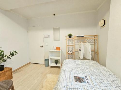 Postel nebo postele na pokoji v ubytování Gurum Stay