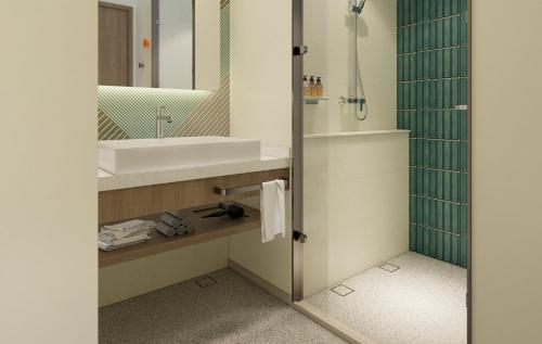 a bathroom with a sink and a mirror at Holiday Inn Express Xi'an Daxing by IHG in Xi'an