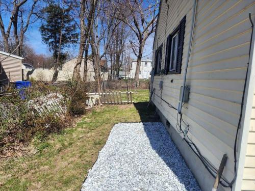 a side of a house with a window on the side at Spacious home away from home in Bloomfield