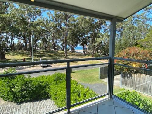 a view from the inside of a house with a window at Jervis Bay Mariners in Huskisson