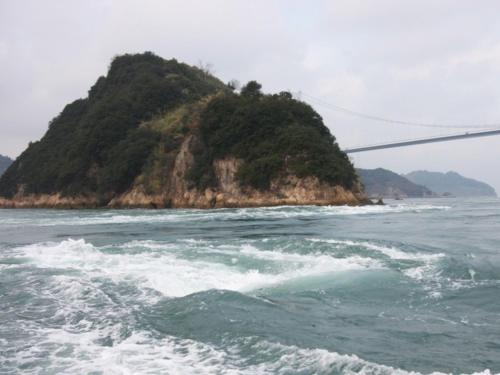 an island in the ocean with a suspension bridge at 汐の丸 in Imabari