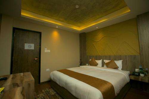 a bedroom with a large bed in a room at Divya Boutique Inn in Kathmandu