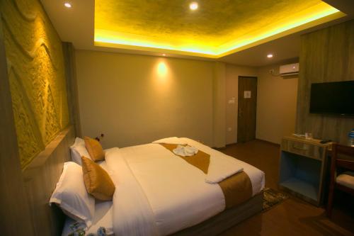 a bedroom with a large bed in a room at Divya Boutique Inn in Kathmandu