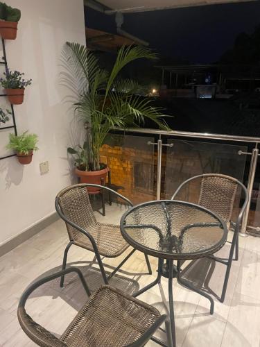 a table and chairs on a patio at night at Salomeapart2 in Tarapoto