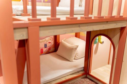 a doll house with a bed and a mirror at PLAY!! Resi Stay in Kyoto
