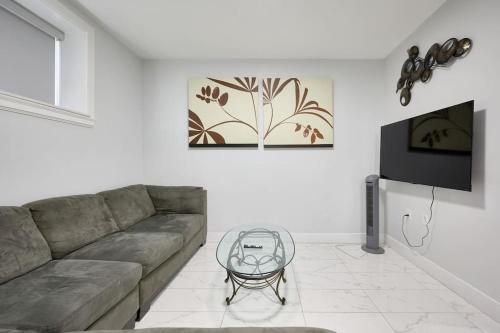 a living room with a couch and a table at Basement Suite In Vancouver in Vancouver