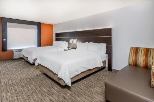 a hotel room with two beds and a window at Holiday Inn Express & Suites - Colorado Springs AFA Northgate by IHG in Colorado Springs